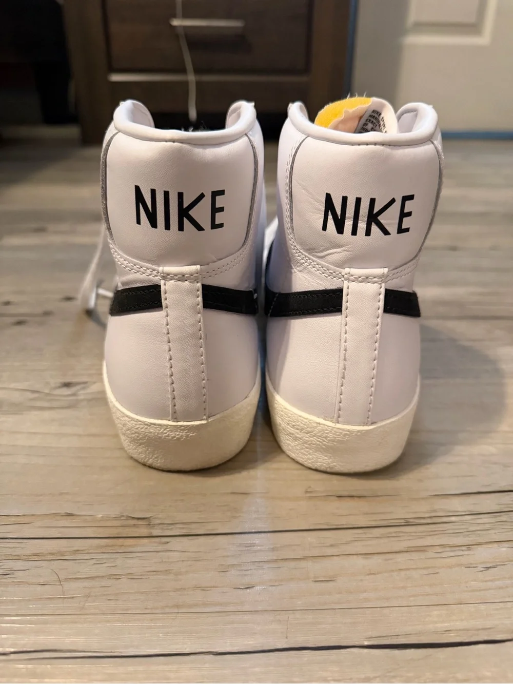 Nike Men’s White High-Top Sneakers with Black Swoosh